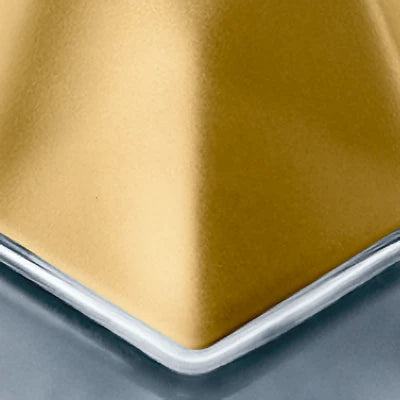 Close-up of engraving location of gold metallic cap of bottle 