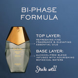 Perfume bottle with bi-phase formula description on a blue background