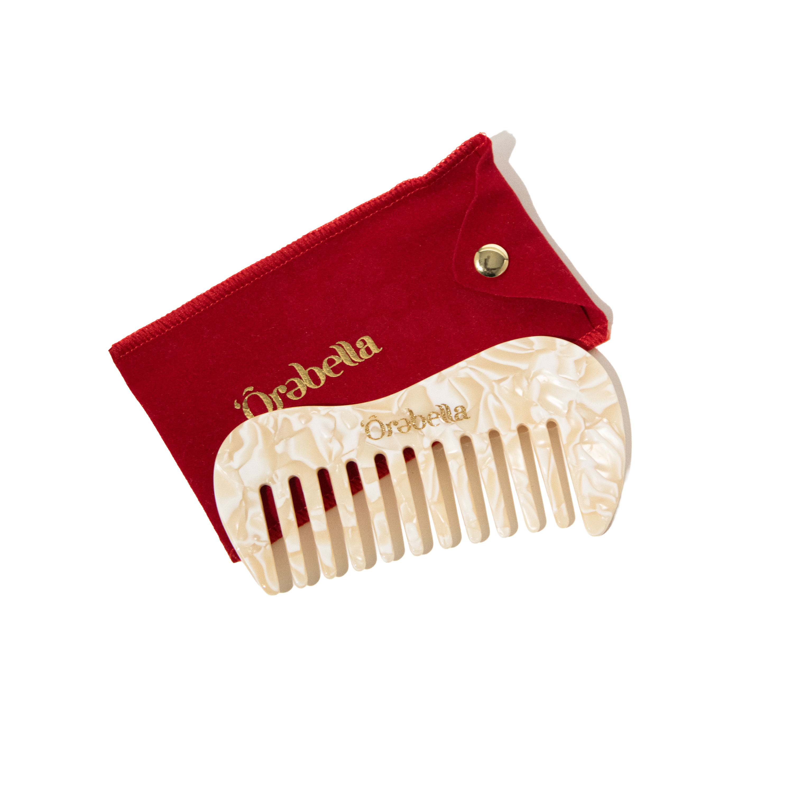 Ôrəbella wide-tooth pocket comb in cream pearl resin with red velvet pouch