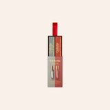 Orabella perfume gift set featuring two 10ml travel spray vials in a matching red and gray box with a red hanging ribbon, shown on a light beige background.