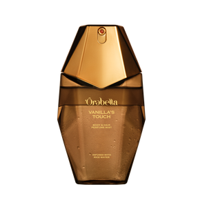 A faceted amber-brown hair & body perfume mist bottle labeled 'Orabella Vanilla's Touch' on transparent.