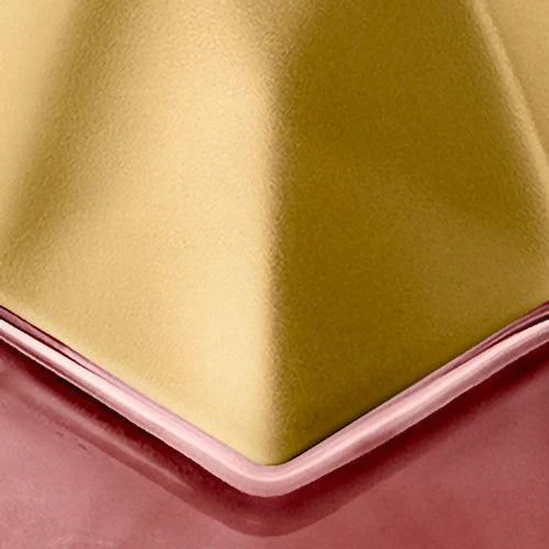 Close-up of engraving location of gold metallic cap of bottle 